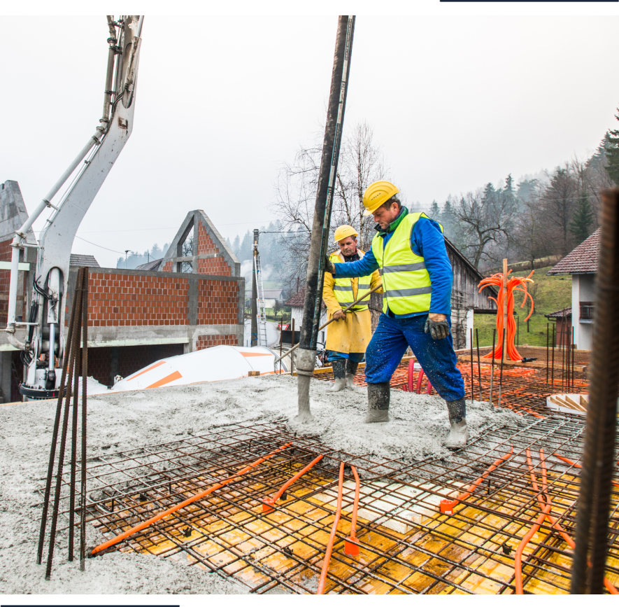 Workers in safety gear at construction site