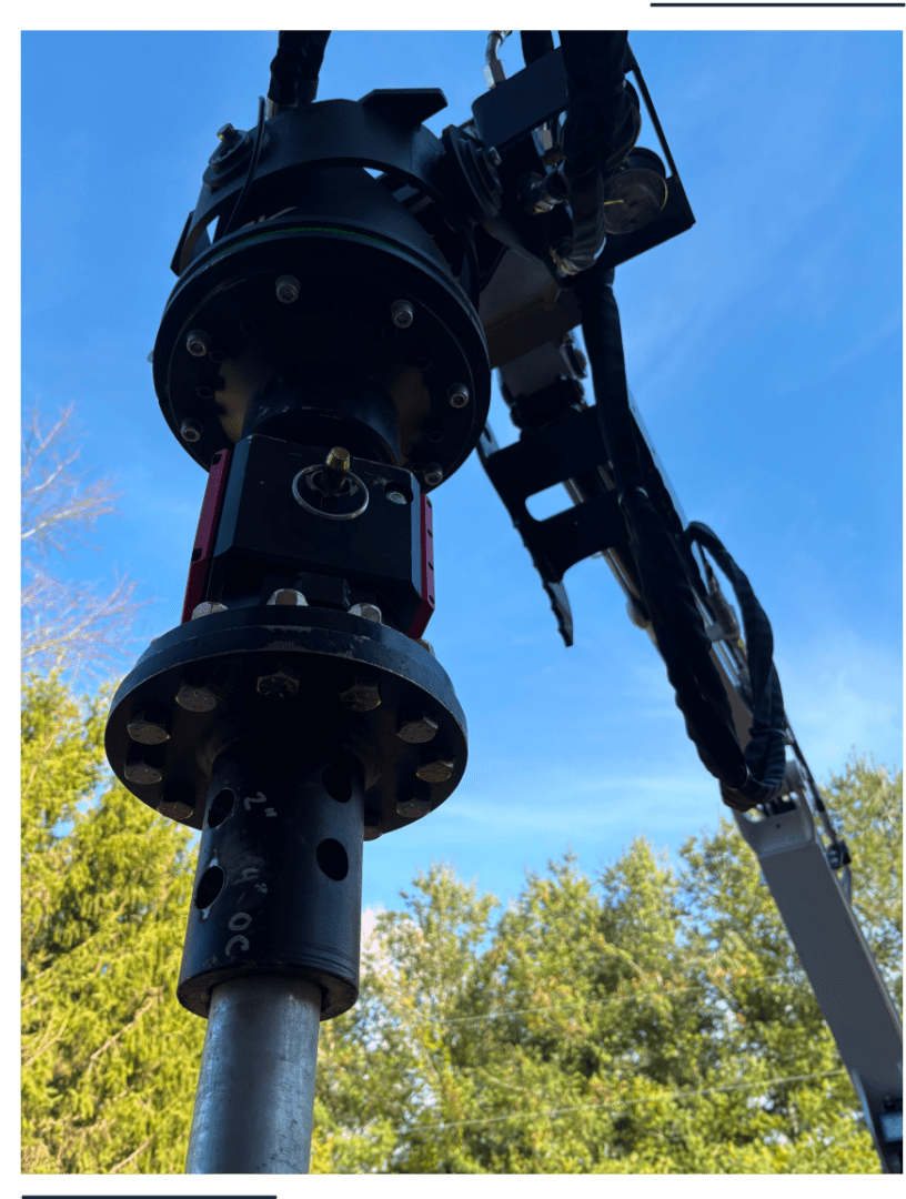 Close-up of telescope mount against blue sky